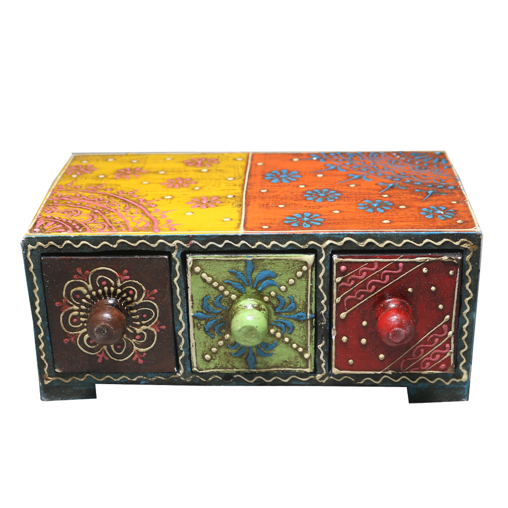 Ethnic chest drawers crafted from wood and ceramic