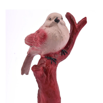 A Beautiful Bird Made Out Of Polyester Resin Sitting On A Tree