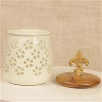 Gorgeous white container with cutout pattern done on it