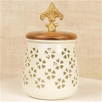Gorgeous white container with cutout pattern done on it