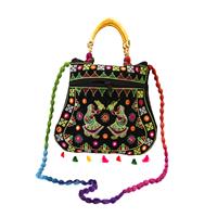 Traditional multicolor purse beautified with tassels and a beaded handle