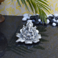 Lord ganesha statue on flower