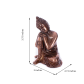 Metal buddha statue resting on knee