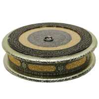 A beautifully designed round dry fruit box with a push in lid.
