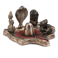 A miniature lord shiv idol made from oxidised metal