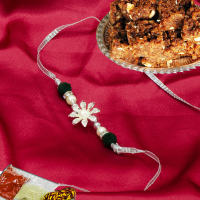 Exquisite floral rakhi for brother with doda barfi