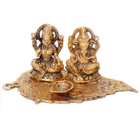 Metal Laxmi & Ganesha Idol on a leaf for Sale