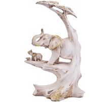 A Beautiful Showpiece Of An Elephant Family With A Tree Created Beautifully