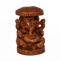 Wooden carving of Ganesh under leaf