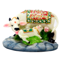 A Flamboyant Set Of Resin Crafted Cow Calf Pair