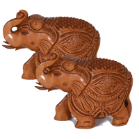 A pair of elephants carved out of wood with beautiful engravings