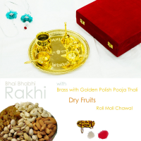 Golden polished pooja thali with  rakhi for bhaiya, dryfruits